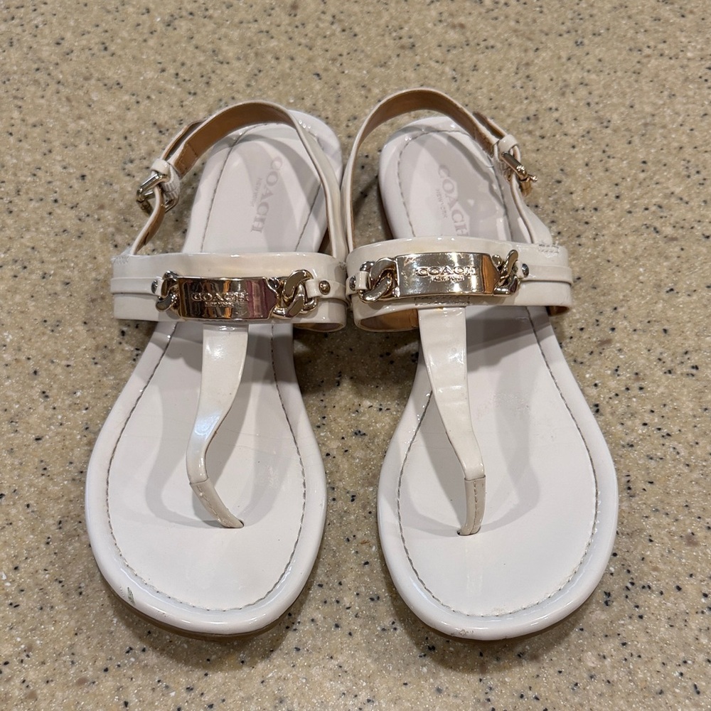 Coach off White Patent Leather T-Strap Sandals with Gold Accents